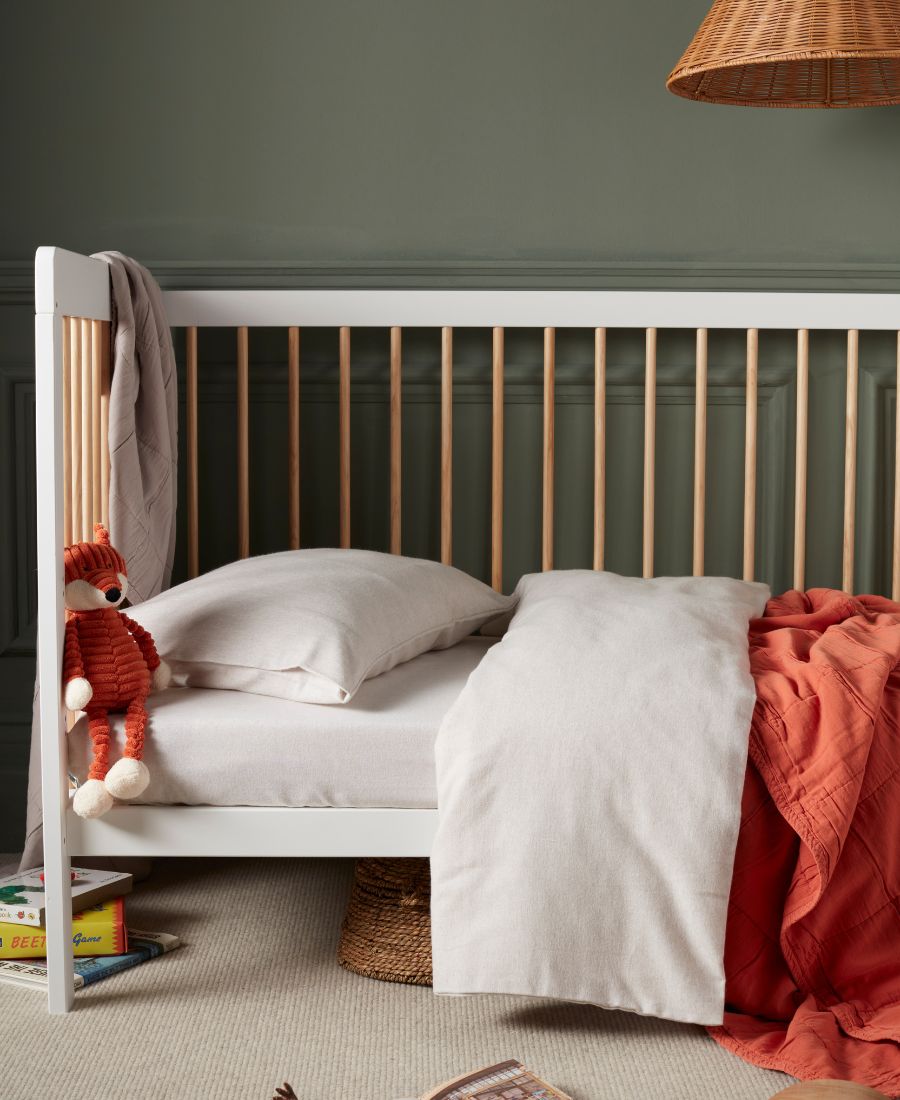 side of a cot bed 