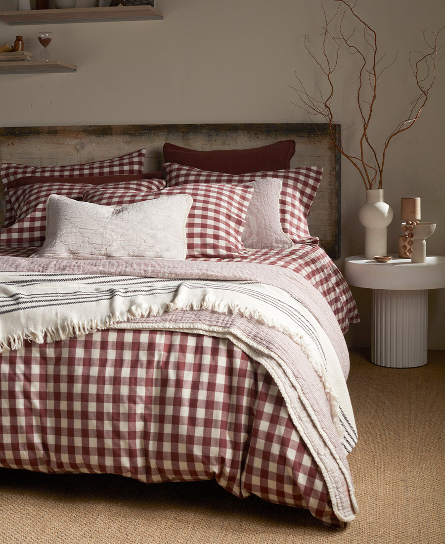 A shot our conker gilbert bed linen with our Beetroot Lenny throw  and cushion cover on top.