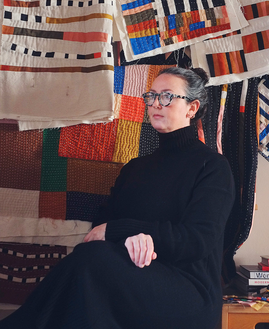 Portrait of Jessie Cutts with  her throws behind her.