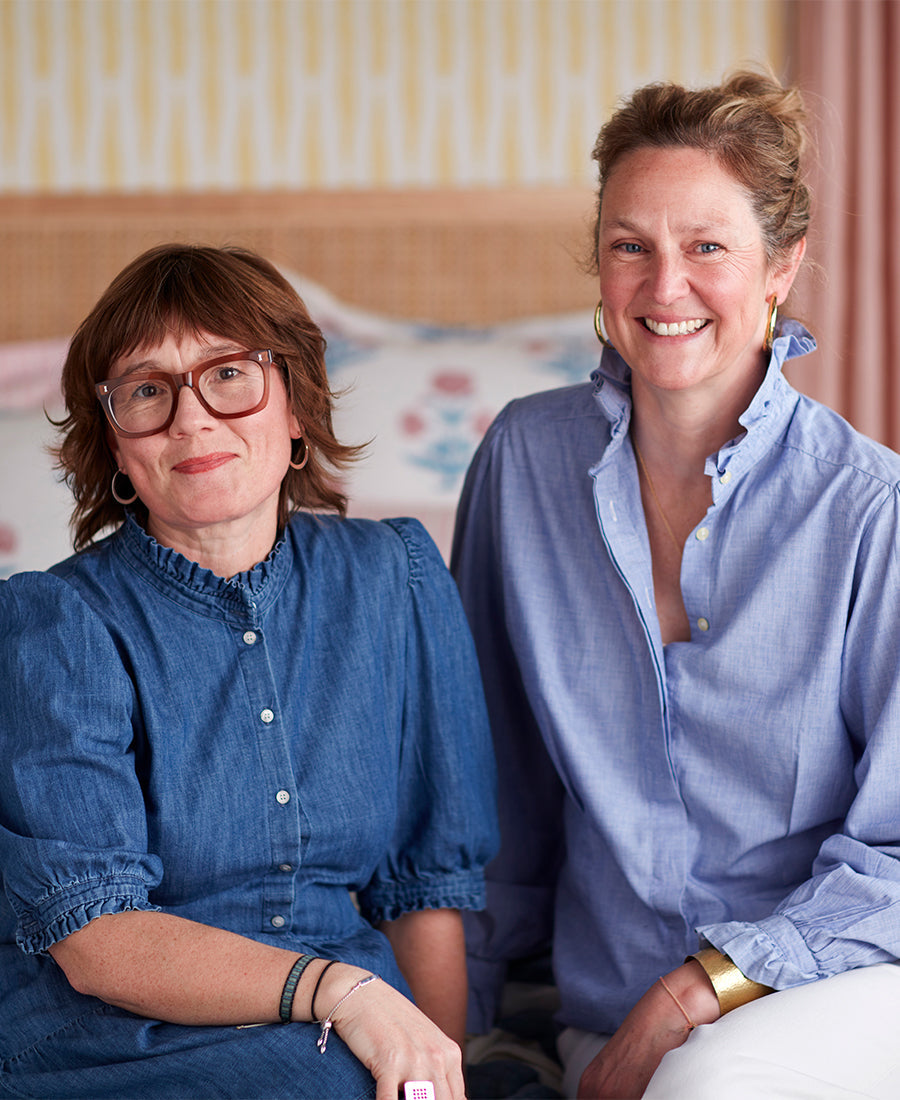 An  image of Molly Freshwater and Molly Mahon  with Molly Mahon Poppy 100% cotton duvet cover in the background.